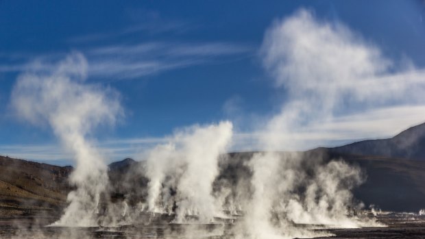 Steam pours from the Tatio Geysers shortly after sunrise, near San Pedro de Atacama, Chile.