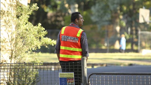 Greater security: A guard monitors the grounds of Haberfield Public School.