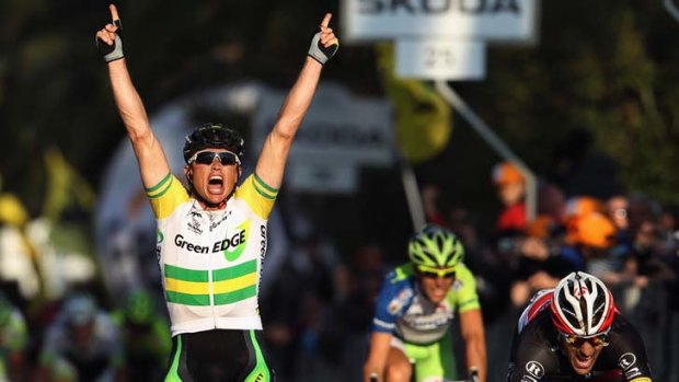 Winning feeling ... GreenEDGE's Simon Gerrans celebrates his superb victory in Milan-San Remo.