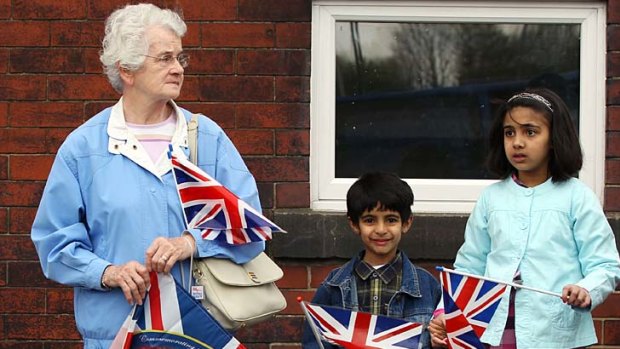 Well-wishers await Prince William and Kate Middleton during a royal visit to Darwen, north-west England, this week.
