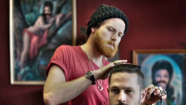 Tom Farmer, barber at Dr Follicles, gives bearded Simon Gordon a haircut.