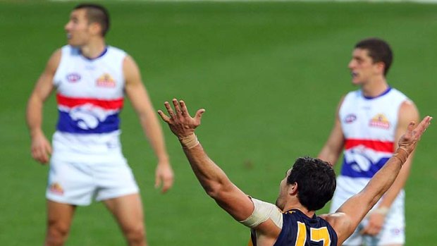 Perfect 10: Eagle Josh Kennedy slots one of his 10 goals against the Western Bulldogs yesterday.