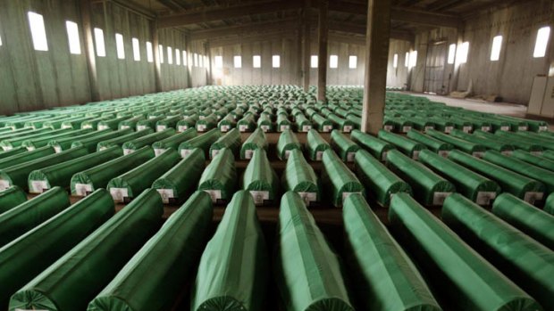 Genocide ... coffins containing the remains of 600 Bosnian Muslims await burial after being exhumed from mass graves near Srebrenica in 2003.  More than 8000 men and boys were killed by units under the command of General Ratko Mladic in and around the Bosnian town in 1995.