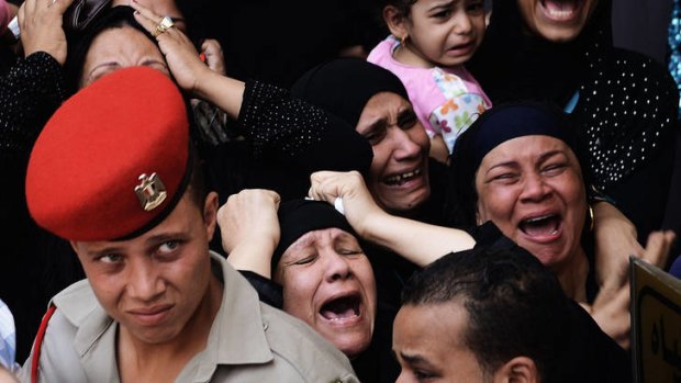 Relatives mourn an Egyptian soldier killed in the attack.