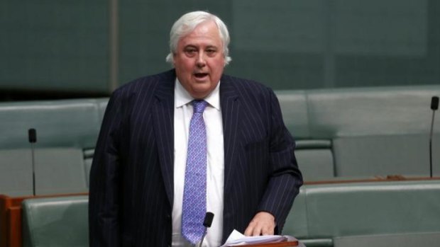 Under fire for treatment of senate staff ... Palmer United Party leader Clive Palmer speaks on the carbon tax in the House of Representatives.