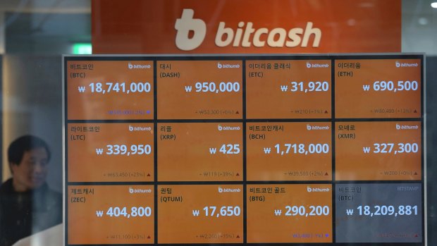 A screen shows the prices of bitcoin  and other cryptocurrencies at a virtual currency exchange office in Seoul, South Korea.