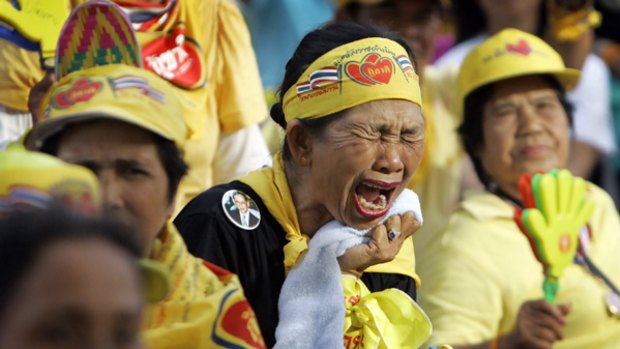 An anti-Government protester reacts to a speech by Thai Prime Minister Samak Sundaravej in which he vows not to resign.