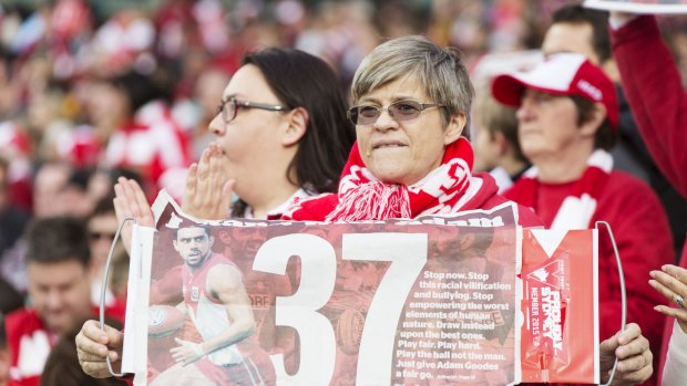 Fans support Adam Goodes with the Fairfax poster.