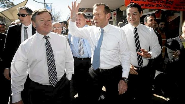 Tony Abbott campaigning with Kent Johns, left.
