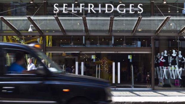 A London cab passes the entrance to Selfridges in Oxford Street.