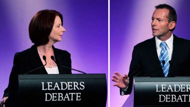 Close call ... Julia Gillard and Tony Abbott during last night's debate.