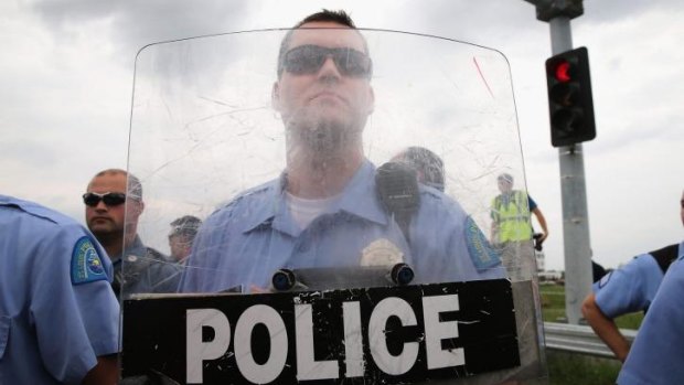 Tense times: A police officer has been shot in the St Louis suburb of Ferguson.