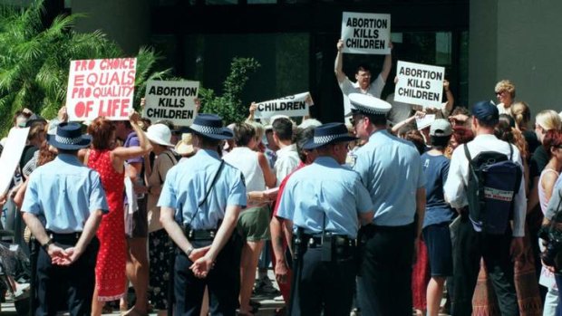 Anti-abortion protesters gather outside a courthouse. Protests such as these will soon be banned from within a certain distance of abortion clinics in Tasmania.