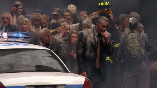 Extras brace for the end of the world on the Collins Street set of the Nicolas Cage film <i>Knowing</i> in April 2008.