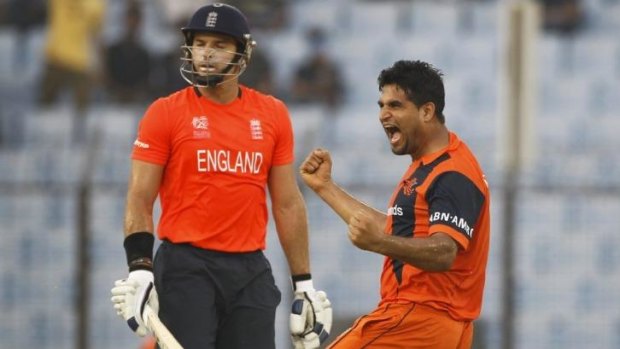 Boilover: The Netherlands Mudassar Bukhari celebrates the wicket of England's Michael Lumb.