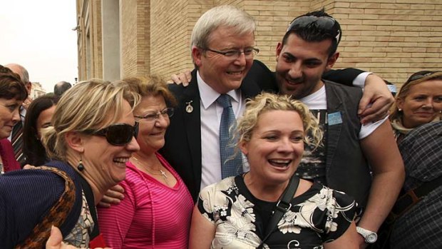 Foreign Minister Kevin Rudd poses with Australian fans in Rome in 2010.