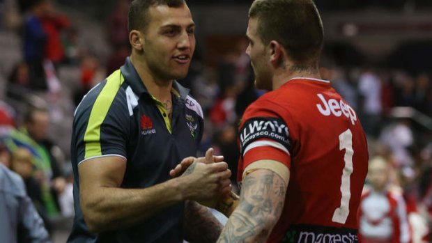 Blake Ferguson of the Raiders and Josh Dugan of the Dragons shake hands at the end of the match.