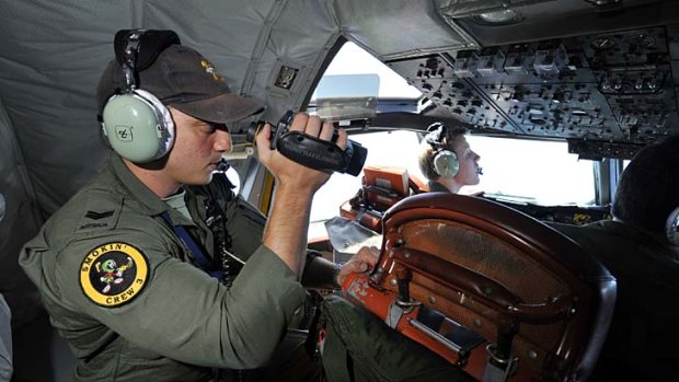 Crew of an RAAF P3 Orion  search for the missing Malaysia Airlines flight MH370.