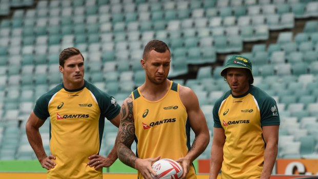 Back in favour: Quade Cooper, centre, training with the sevens team in Sydney.