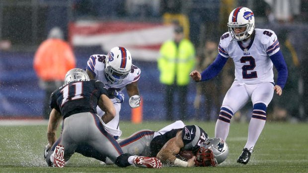 Nate Ebner of the New England Patriots recovers an on-side kick by Dan Carpenter of the Buffalo Bills.