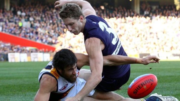 Zac Dawson of the Dockers and Josh Kennedy of the Eagles contest for the ball during Saturday's clash. 