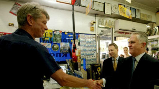 A friend in the business ... Malcolm Turnbull greets an old school chum, Don Wormald, at his hardware store in Turramurra.