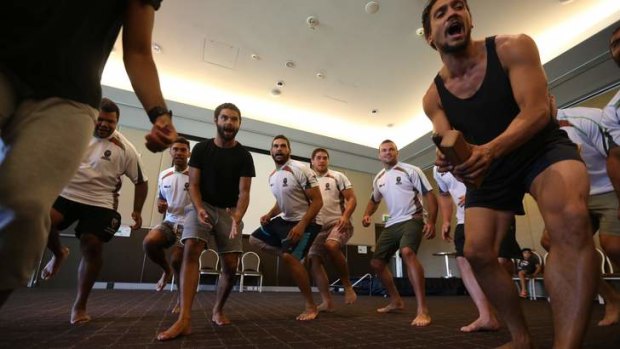 New ritual: Aboriginal NRL players perform with Bangarra Dance Theatre.