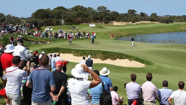 Distant star &#8230; Tom Watson pulls a crowd to watch him putt on the 11th green.