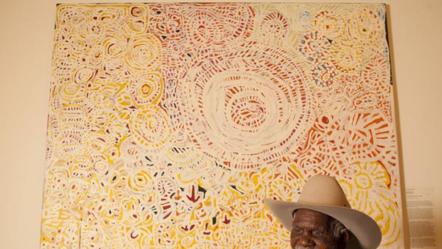Senior law man and traditional healer Dickie Minyintiri with his winning painting.