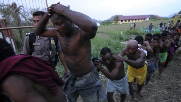 Police arrest attendees of the Third Papuan People Congress in Abepura.