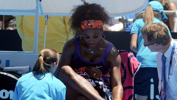 Angst: Serena Williams attends to her injury.