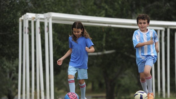 News. Two members of the Little family of Wanniassa have been chosen to be mascots for Asian Cup games this weekend at Canberra Stadium. Paige, 9 and her brother Luke, 8, playing on a reserve near their home. January 7th 2015
The Canberra Times photograph by Graham Tidy.