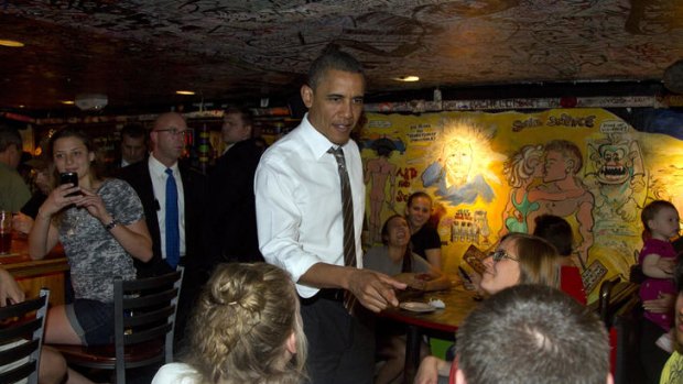 US President Barack Obama greets people at The Sink Restaurant and Bar in Boulder, Colorado.