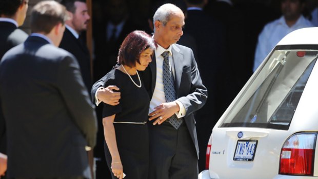 Winnie and Ronnie Miranda grieve after the funeral of their sons Ashish and Akshay, who died in a glacier accident in New Zealand.