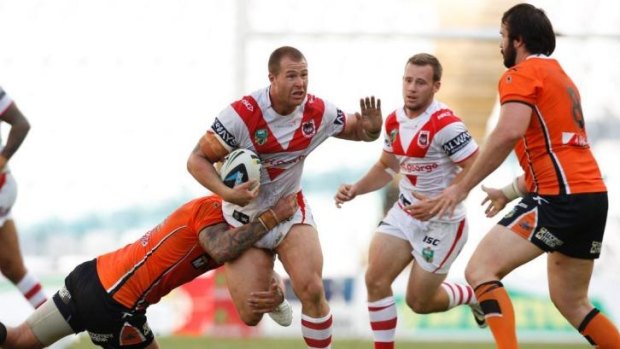 Dragons prop Trent Merrin on the charge against the Wests Tigers last weekend.
