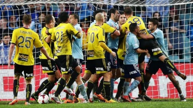Feisty affair:  Sydney FC and Wellington Phoenix players clash in the goalmouth.
