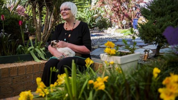 Lyn Goldsworthy only lets her cats into the garden on a leash to protect native birds.