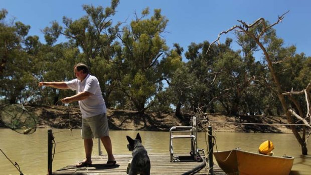 ''A lot of people have gone broke on this river, and they always will'' &#8230; Ron Page pulls a yabby pot from the river.