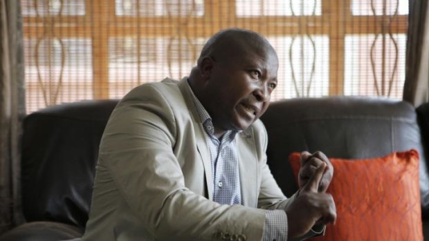 Thamsanqa Jantjie gestures at his home during an interview with the Associated Press in Johannesburg, South Africa, on December 12, 2013.