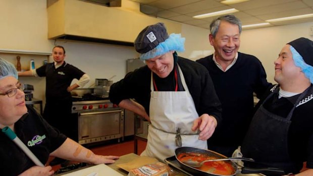 Determined  ...   Jo Ward, far left, Vaughan Taylor, centre, and Damian Showyin, far right, with his father, Lindsay, want to keep working at Upper Crust cafe.