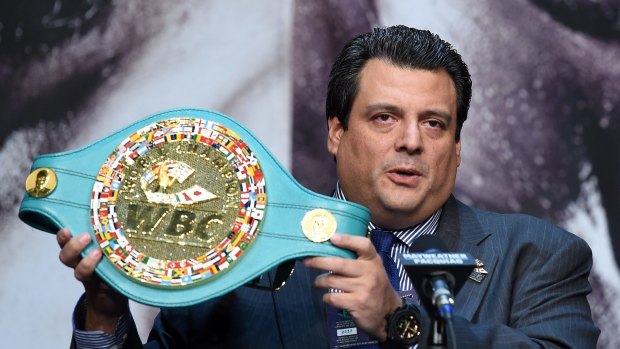 WBC President Mauricio Sulaiman displays a championship belt on offer.