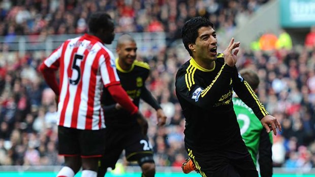 Luis Suarez of Liverpool celebrates his wonder goal against Sunderland.