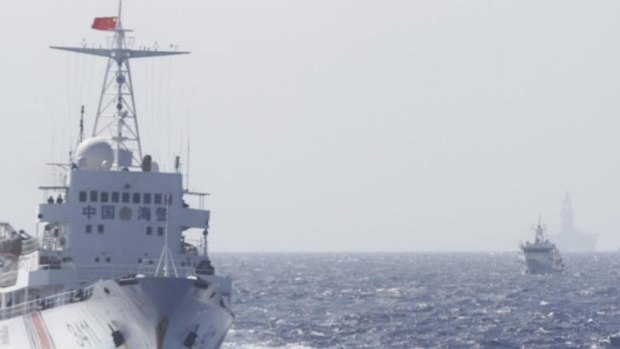 Ships of Chinese Coast Guard are seen near the first Chinese oil rig in disputed waters in the South China Sea. China now plans to send a second rig near Vietnamese waters.
