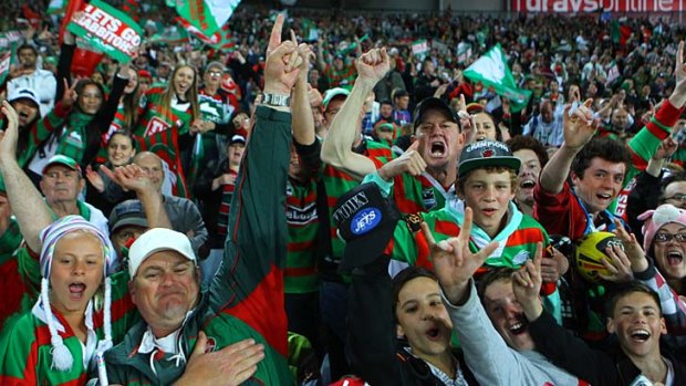Ecstatic ... the Rabbitohs fans, who could be heard singing throughout the match, celebrate the 38-16 win against the Raiders at ANZ Stadium.