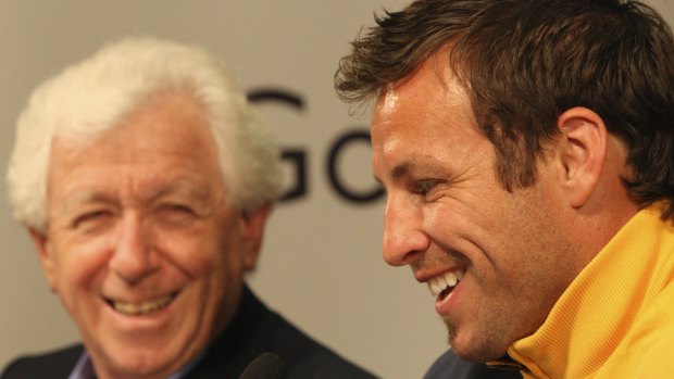 Successful era: Frank Lowy with Socceroos captain Lucas Neill in 2009.