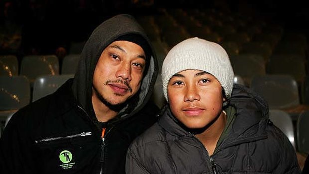 Big shoes to fill ... former All Blacks skipper Tana Umaga and son Cade in the stands at Stade de France in 2006.