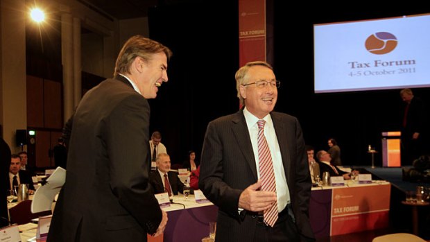 Following the script &#8230; Rob Oakeshott and the Treasurer, Wayne Swan, share a joke during a break at the summit.