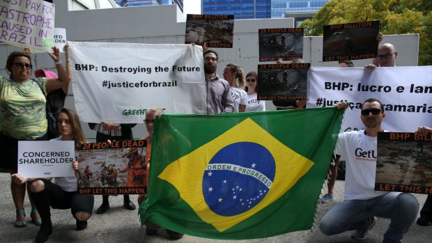 Greenpeace and Get Up activists protest outside the international Annual General Meeting of BHP Billiton in Perth.