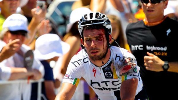 A bloodied Mark Cavendish crosses the finish line at Mannum yesterday.