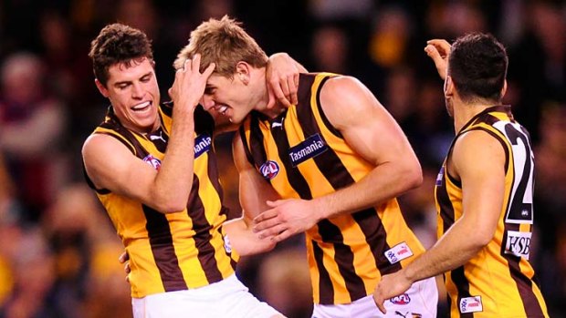 Hawthorn's Ryan Schoenmakers celebrates a goal with Isaac Smith.